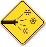 snowmaking warning sign at tremblant ski resort indicating active snow guns operating on ski slopes