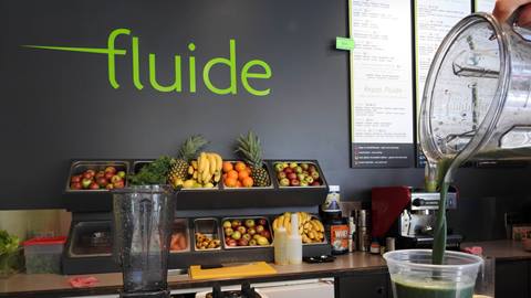 Interior counter and fresh fruit display at Fluide Juice Bar in Tremblant.