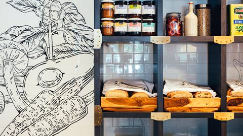 Artisanal food display and mural at Le Comptoir restaurant in Tremblant.