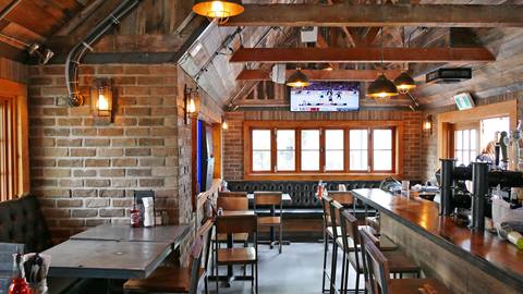 Interior bar and seating area with a sports-pub vibe at Yaoooo Pizza Pub Tremblant.