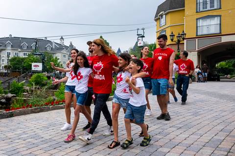 Families celebrating Canada Day in the Mont-Tremblant pedestrian village.